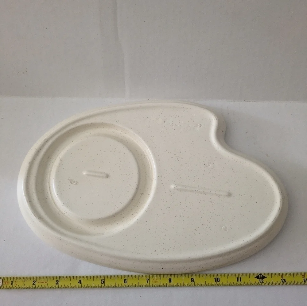 Retro speckled ceramic platter chip and dip.